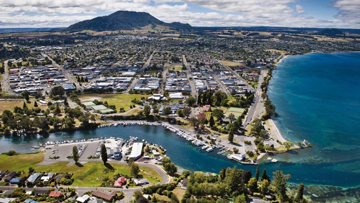 Aerial drone view of Taupo city and Lake Taupo in the background